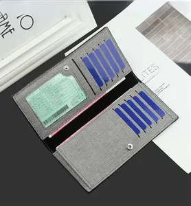 Detail view of canvas wallet interior featuring ten card slots and a clear ID window
