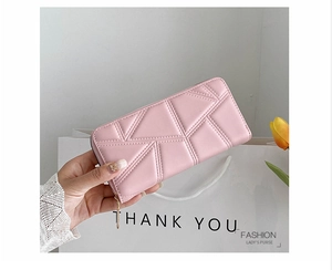 Detail of pink PU leather long wallet with quilted geometric stitching and zipper