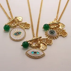 Bohemian evil eye and Fatima hand pendant necklace with gold toggle clasp and beads