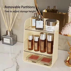 Cream 3-tier adjustable cosmetics organizer with clear shelves on marble tabletop