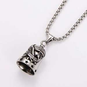 Detailed shot of silver bell pendant with Live To Ride engraving on Venetian chain