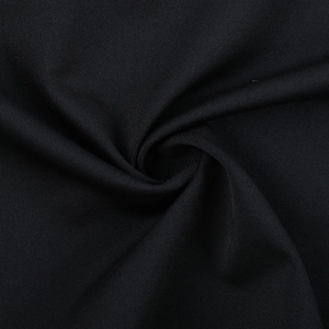 Close-up of the black high-density fabric texture with soft drape and refined knit pattern