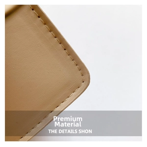 Detailed view of precise stitching on a beige leather quilted crossbody bag strap