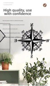 Nautical vintage metal compass wall decor in black iron hanging on a white wall decoration