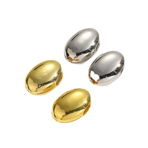 Minimalist high-polish oval hoop earrings in gold and silver finishes on white background