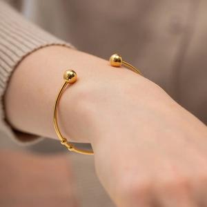 Polished 18K gold-plated stainless steel open bangle with minimalist metal beads