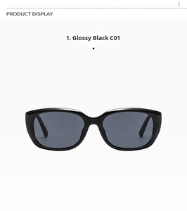 Detailansicht der glänzend schwarzen Cat-Eye Sonnenbrille mit dunkelgrauen Gläsern und Scharnier