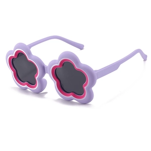 Flower-shaped kids sunglasses with purple frames and pink petals for sun protection