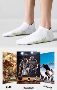 Detail view of white athletic socks with green stripes for running, basketball and cycling