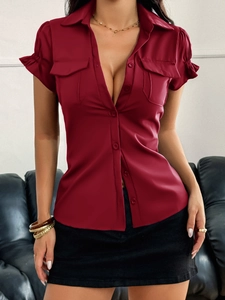 Front view of a deep red button-down short sleeve blouse with pockets and lapel collar