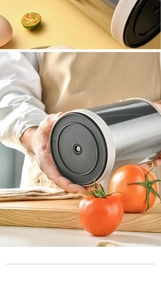 Detailed base of rotating kitchen tool organizer showing sleek stainless steel finish
