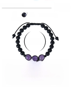 Detail of 8mm amethyst beads and black matte stone on hand-woven adjustable rope bracelet
