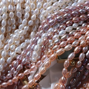 Lustrous 5-6mm natural freshwater rice pearls in white, pink, and purple shades