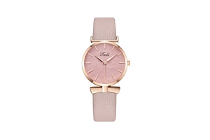 Detailed macro of the rose gold watch case with textured leaf patterns on pink dial