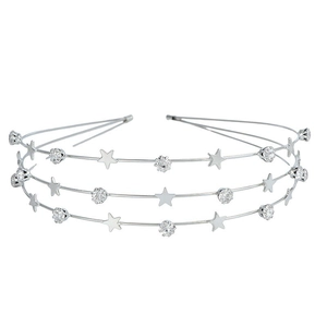 Detailed view of silver triple-layer headband with stars and clear crystals on white background
