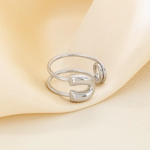 Detailed view of the polished safety pin design on the creative stainless steel open ring