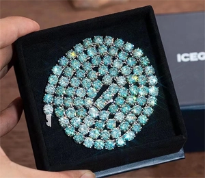 Macro shot of 925 sterling silver light blue moissanite tennis bracelet in a black jewelry box