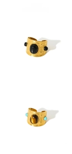 Detail of vintage 18k gold plated rings featuring black onyx and natural tiger eye stones