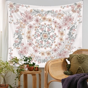 Detailed view of floral mandala tapestry with tassels in a cozy bohemian home setting