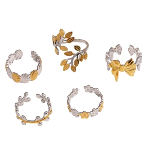 Two-tone silver and gold adjustable open rings set with leaf and floral designs