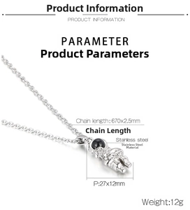 Detail view of astronaut pendant necklace with rose and exact product dimensions