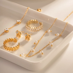 Detailed view of 18K gold stainless steel jewelry set with freshwater pearls and crystals