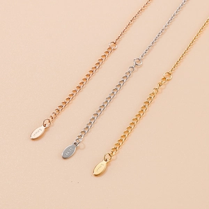 Three-color stainless steel extension chains in rose gold, silver, and gold with drop tags