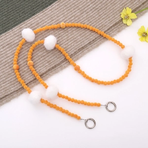 Orange flocked beads and white fur ball crossbody bag strap with metal ring clasps