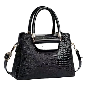 Glossy black crocodile pattern bucket bag with double handles and shoulder strap