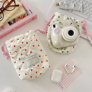 Quilted heart-print camera storage pouch with drawstring closure for travel protection