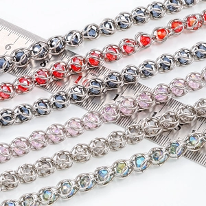 Macro detail of 6-8mm stainless steel beaded chain with colorful crystal glass beads
