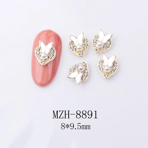 Detail of 8x9.5mm heart-shaped nail gems with alloy butterfly, rhinestones and pearl