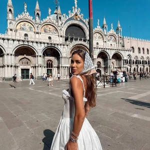 White ruffle mini dress for women with holiday style featuring a matching headscarf