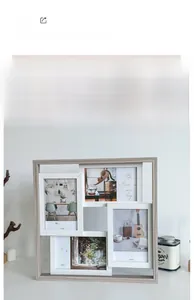 Detail of a minimalist multi-photo frame for four 4x6 inch pictures with a natural wood finish