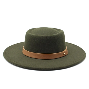 Detailed shot of dark green wool felt boater hat with a brown leather decorative band