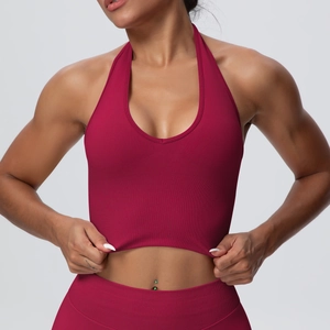 Detailed view of burgundy ribbed yoga set showing high elasticity and seamless fabric texture