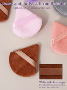 Macro shot of 14-piece makeup sponge set showing wide ribbons and fine stitching detail