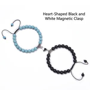 Detail of heart magnet clasp connecting blue turquoise and black beads on couple bracelets