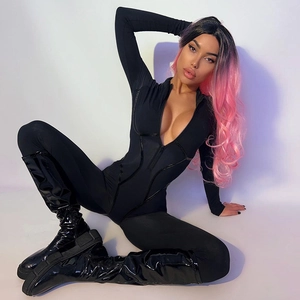 Detail of female black bodycon jumpsuit featuring long sleeves and a V-neck metal zipper