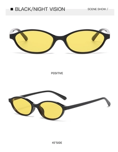 Macro detail of oval night vision sunglasses with black frames and yellow lenses