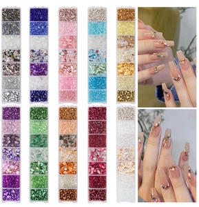Detailed view of colorful iridescent nail art glass stones and mixed shell fragments in box