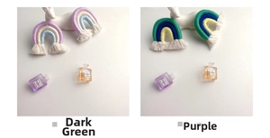 Detail of handmade woven rainbow charms with cotton tassels in purple and dark green tones