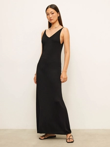 Detail of slim fit black V-neck knitted camisole maxi dress with elegant long hem