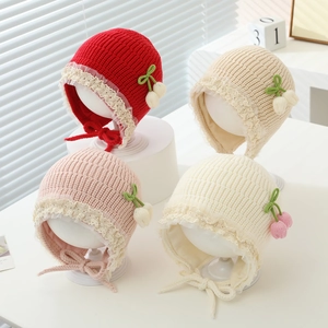 Toddler winter knit earflap hat with lace trim and floral accents in four colors