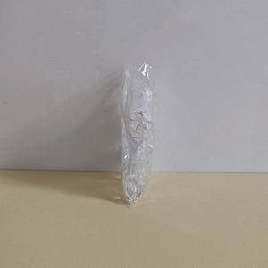 Detailed view of bulk silver metal rings packaged in a clear plastic craft bag
