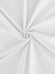 Close-up detail of premium white combed cotton fabric showing soft knit texture and weave