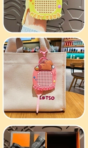 Detail showing Capybara bead puzzle keychain with pink stylus and metal clip