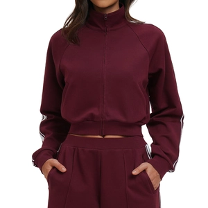 Women's burgundy color-block tracksuit with high neck zip jacket and striped sweatpants