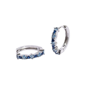 Detailed view of silver hoop earrings with alternating navy and light blue square zircons