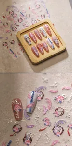 Macro detail of embossed nail stickers with Chinese phoenix and peony flower motifs